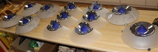 Six frosted glass chrome and blue glass circular uplighters and four similar wall lights